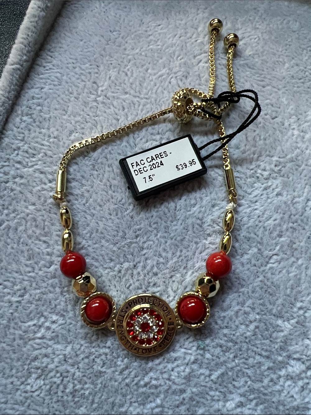 Gold-Tone Bracelet with Red Beads and Decorative Medallion